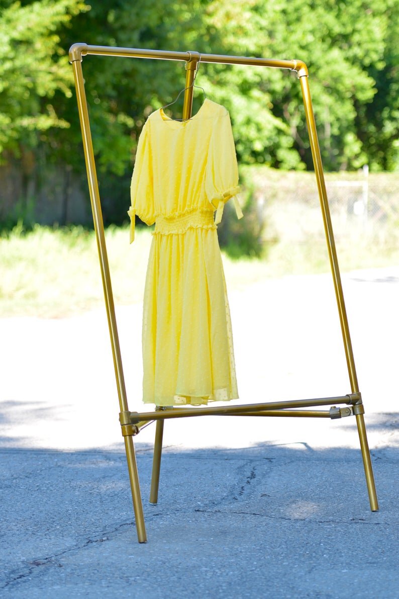 Gold Triangular Garment Rack